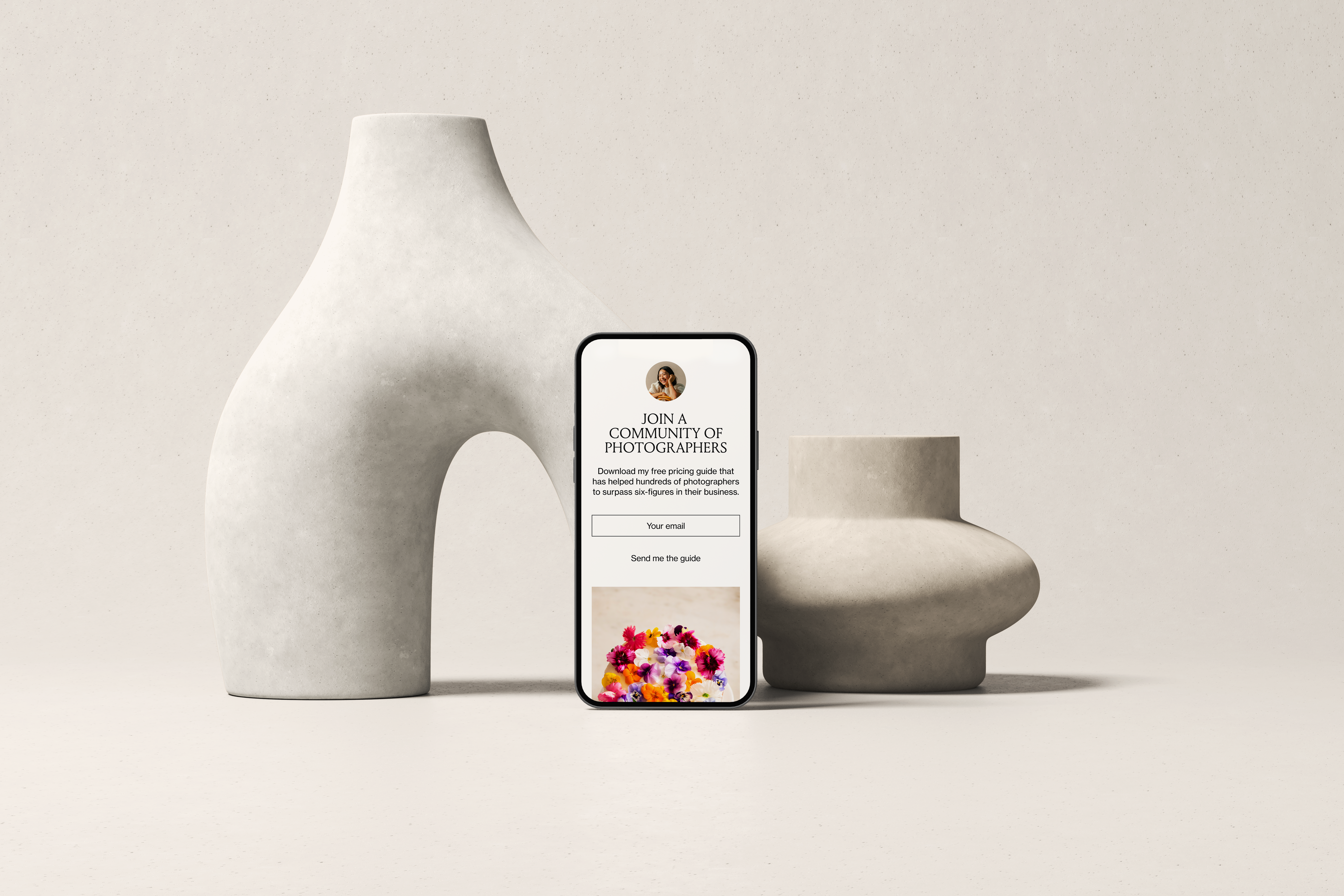 Cellphone mockup showing Flodesk email with two stone vases in the background