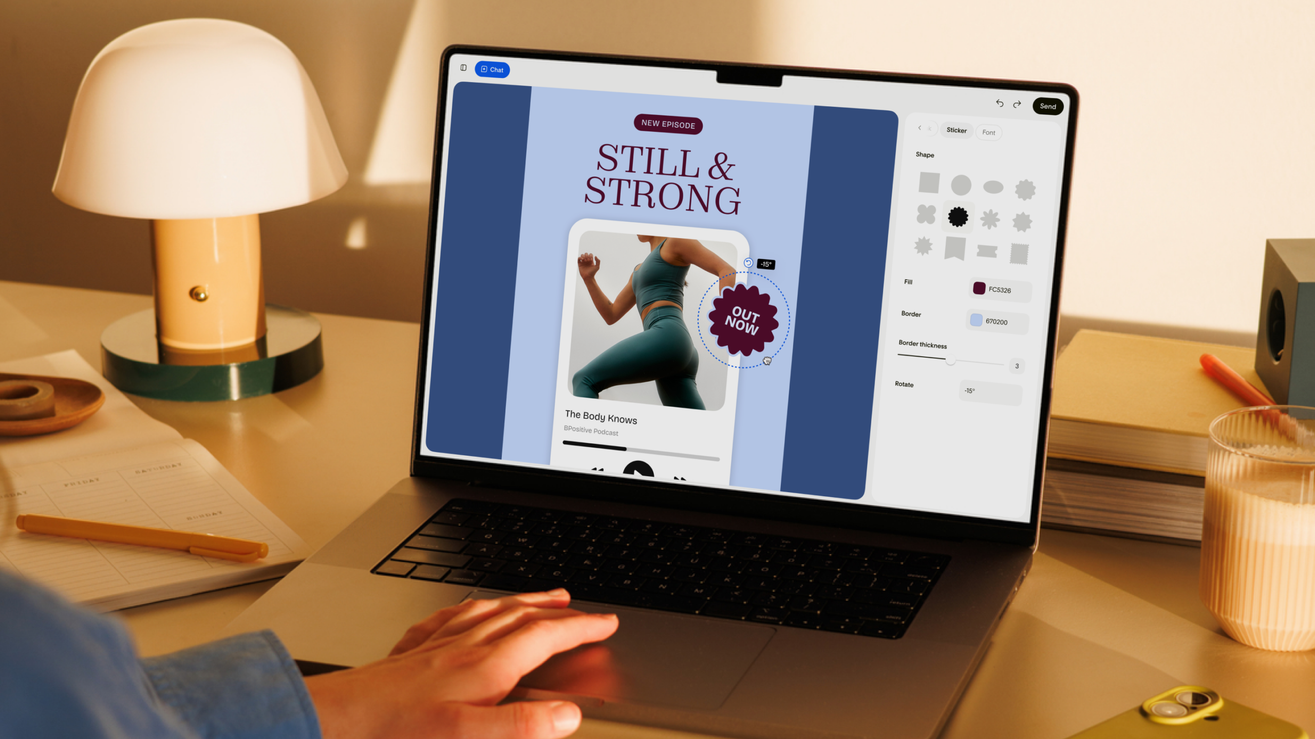 Hand typing on a laptop showing the Flodesk Studio AI email designer