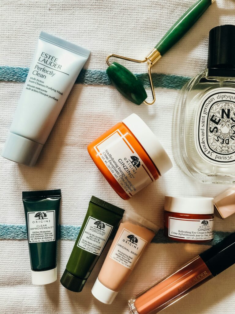 Various assorted tubes of face creams and lotions are laid out on a table 