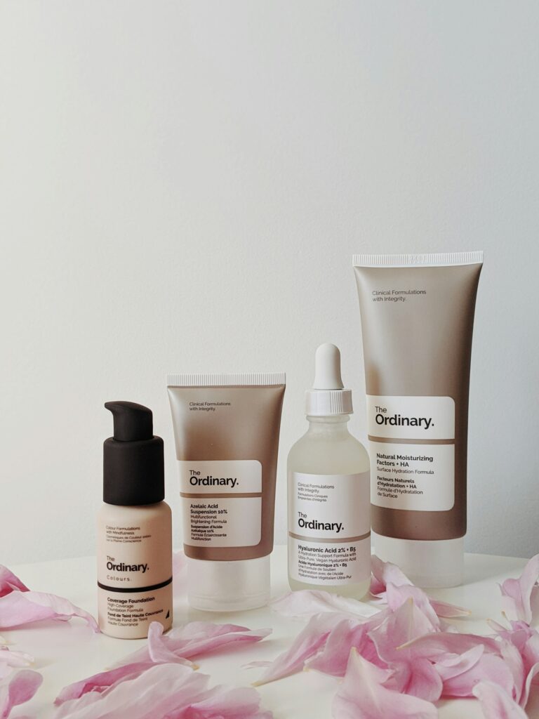 Four bottles and tubes of Origins Cosmetics products sit side by side