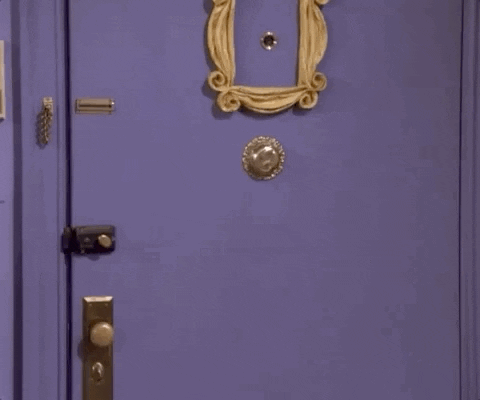 Gif of Monica from TV show 'Friends' falling through purple apartment door